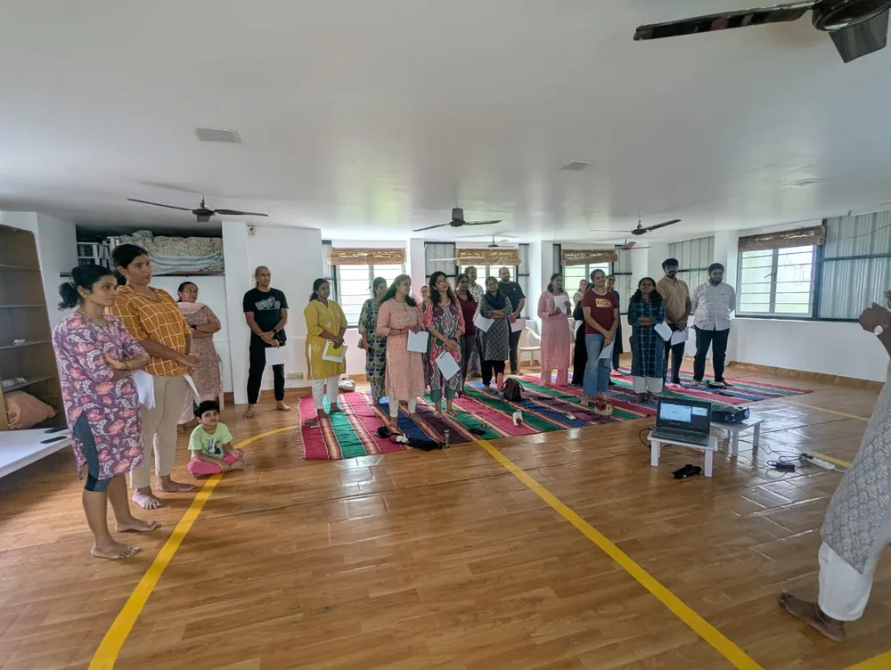 Participants standing together at the start of a Mindful Mirror workshop